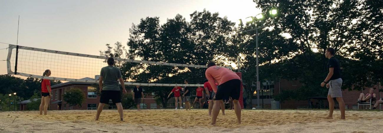 Students on sand volleyball courtvolleyball