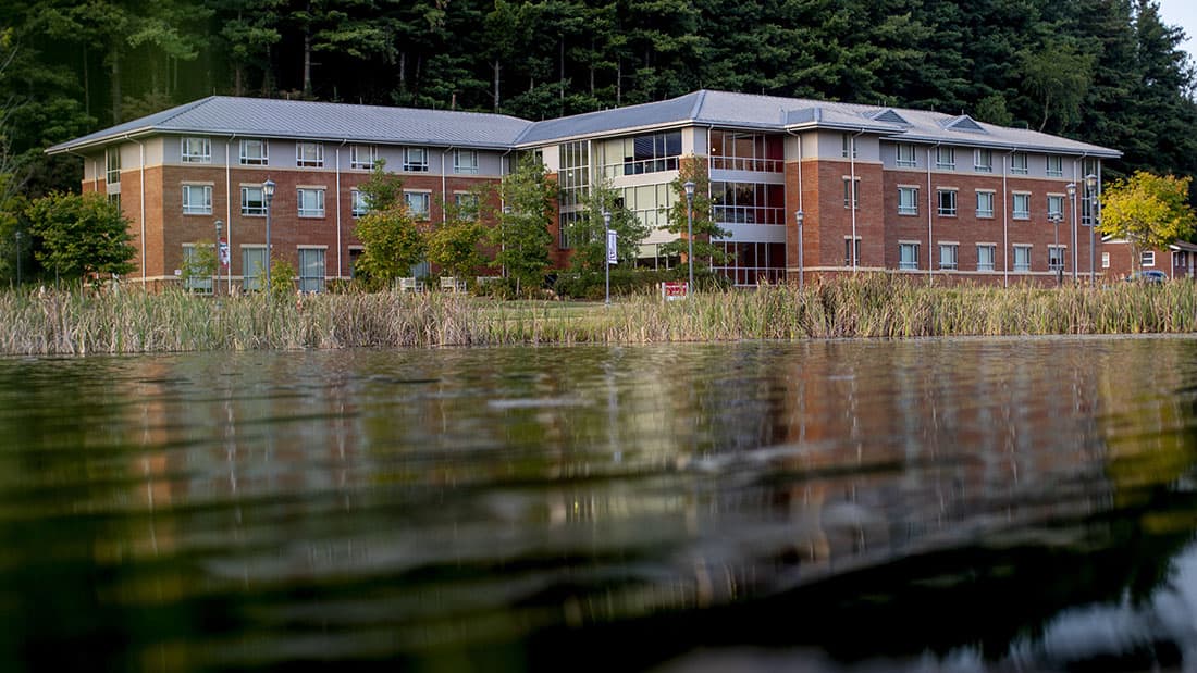 Residence hall exterior by lake