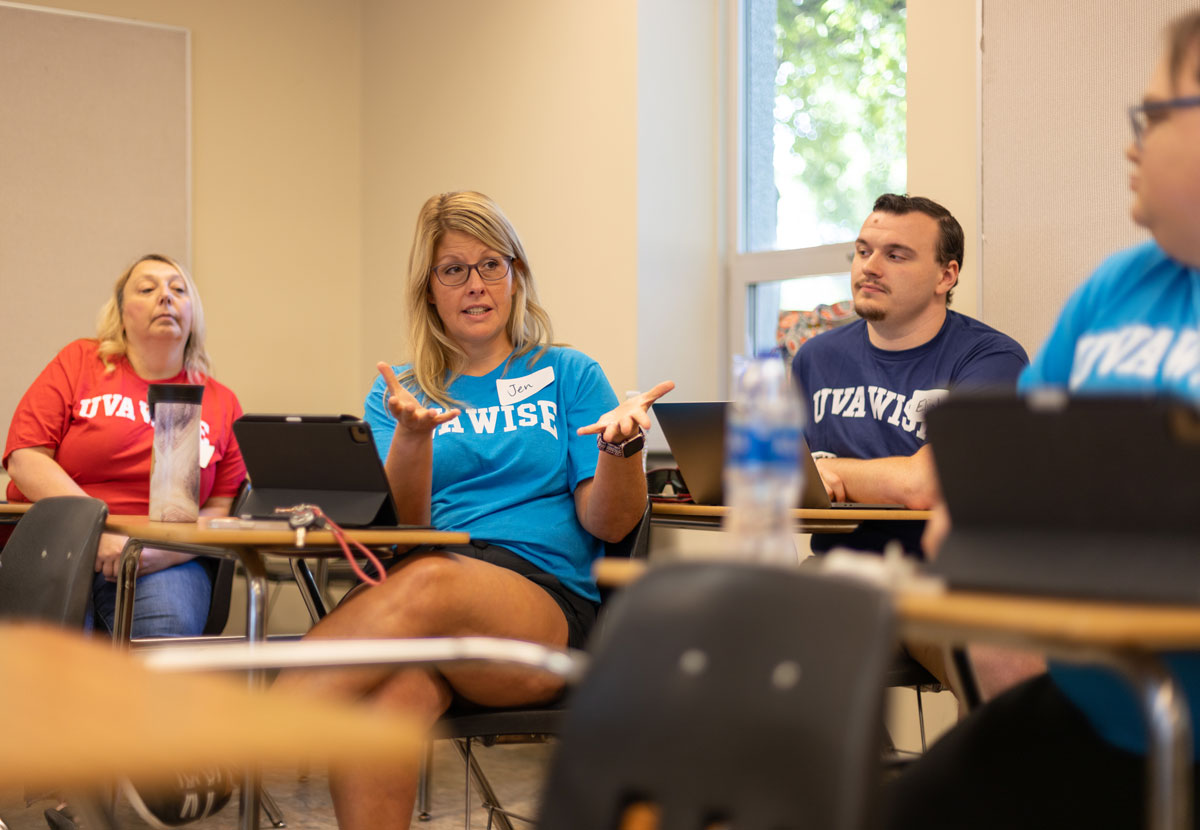 Teachers in discussion in classroom