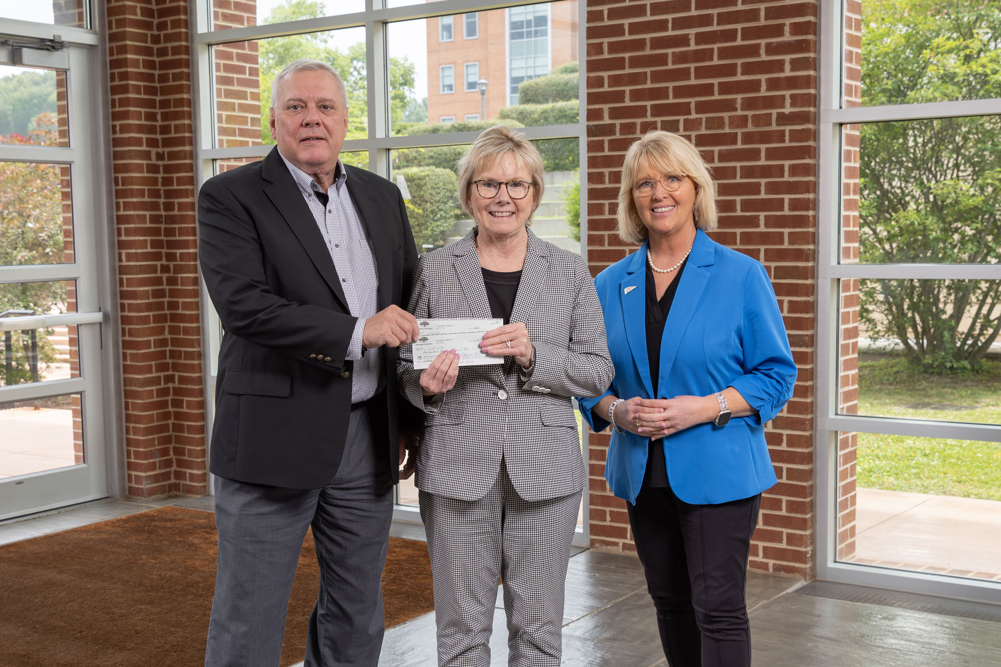 Left to right: Rapha Foundation Executive Director Mark Vanover, Chancellor Donna P. Henry and Vice Chancellor for Advancement and Alumni Engagement Valerie Lawson