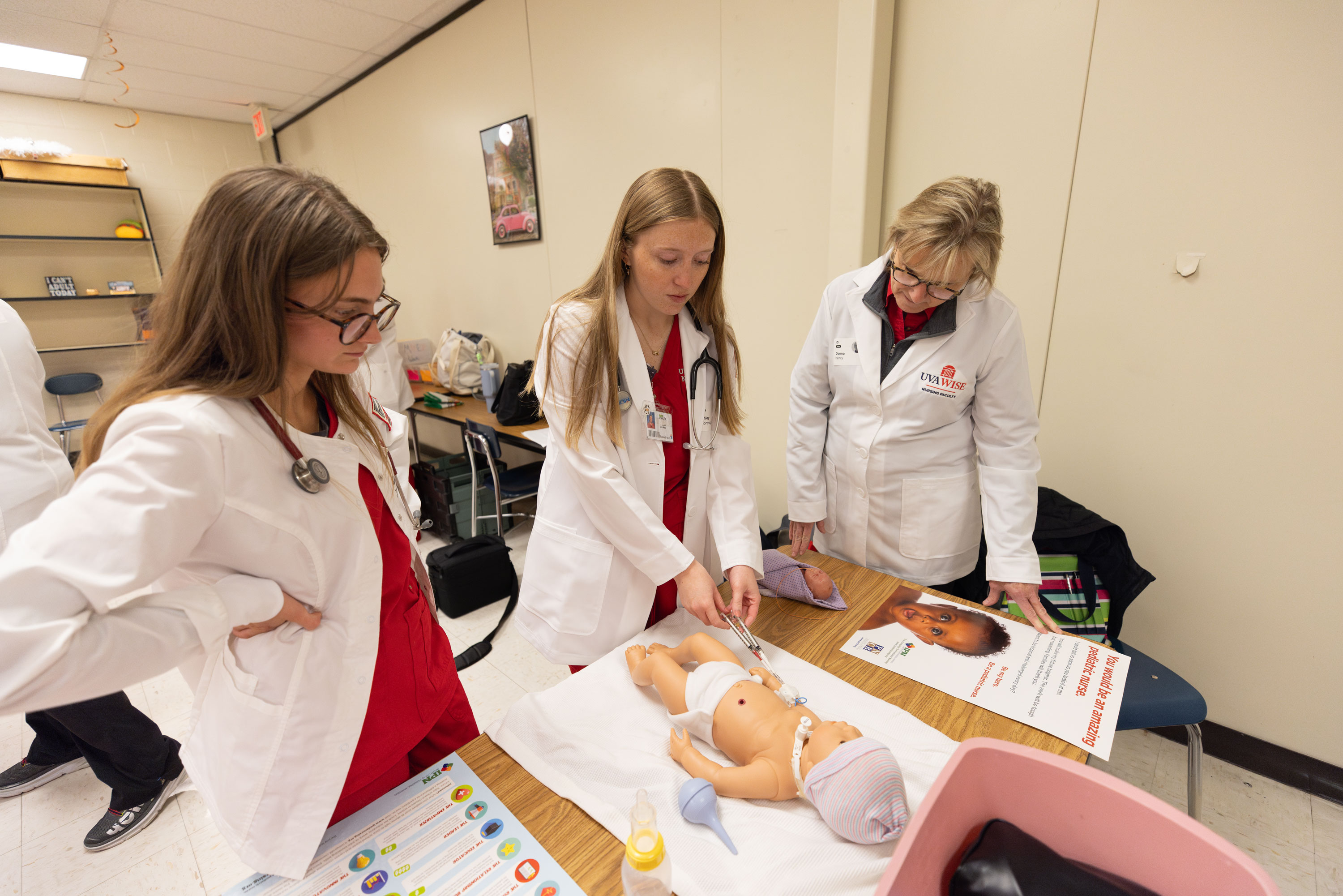 Tay Willinghan and Chancellor Henry in nursing class