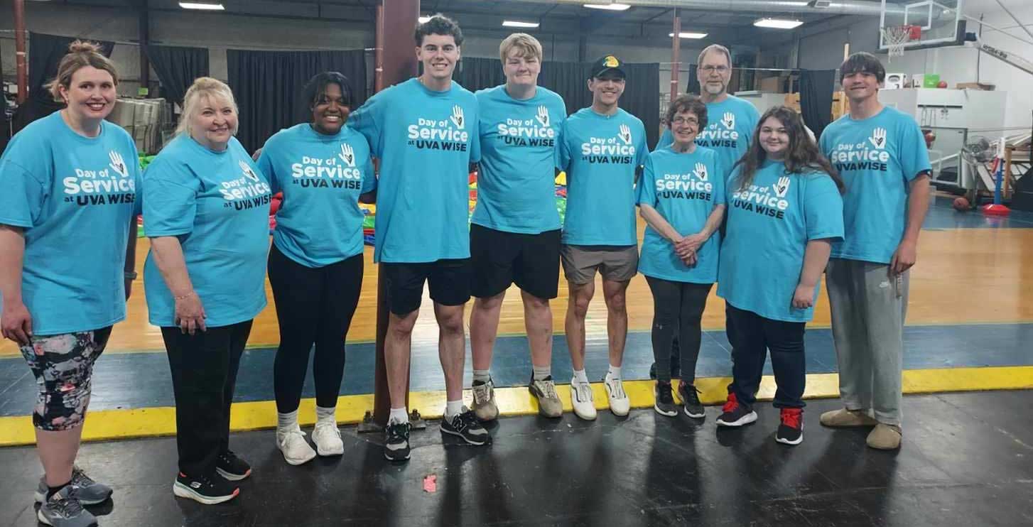 Group of students and employees in Day of Service shirts