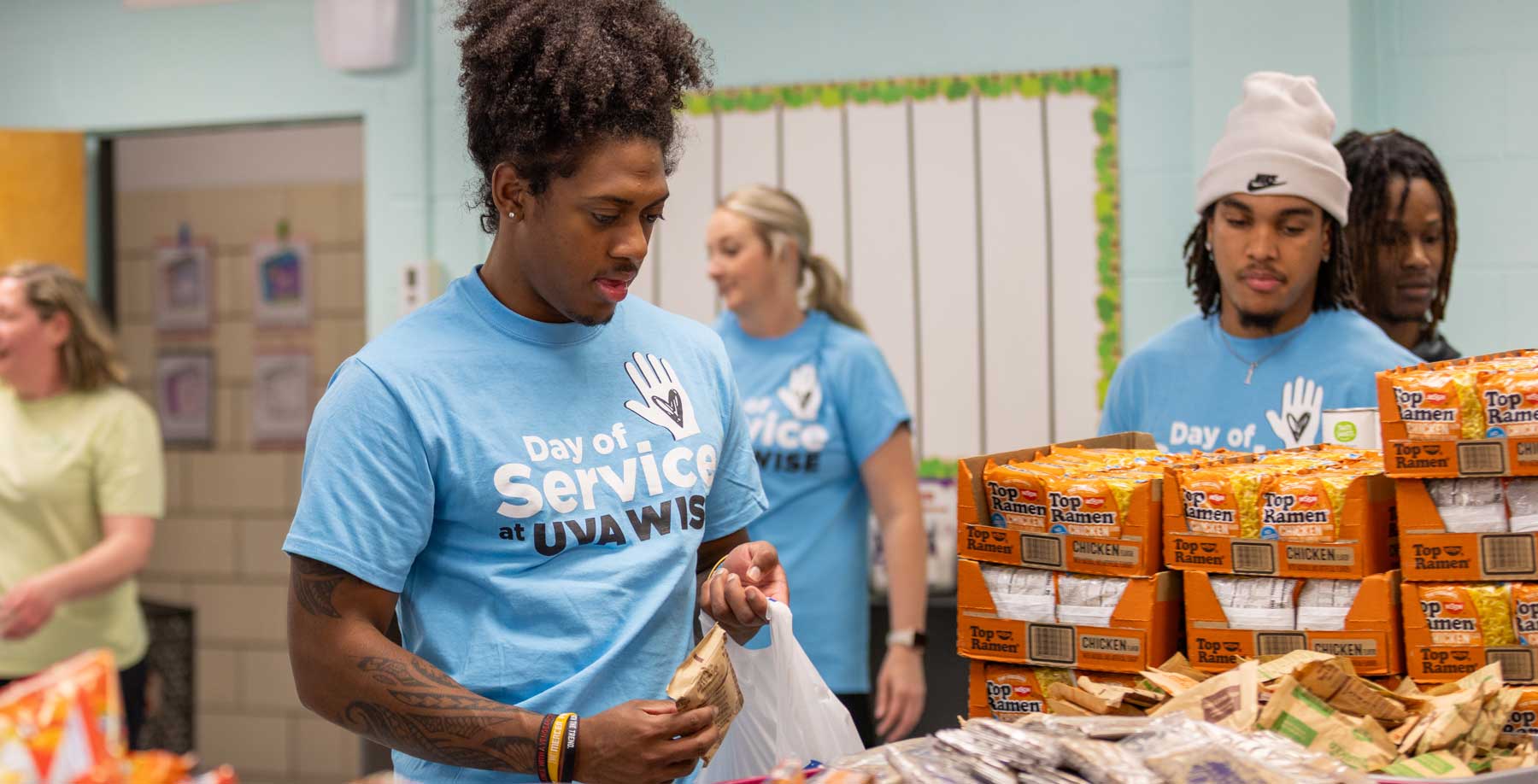 Student packing lunchboxes