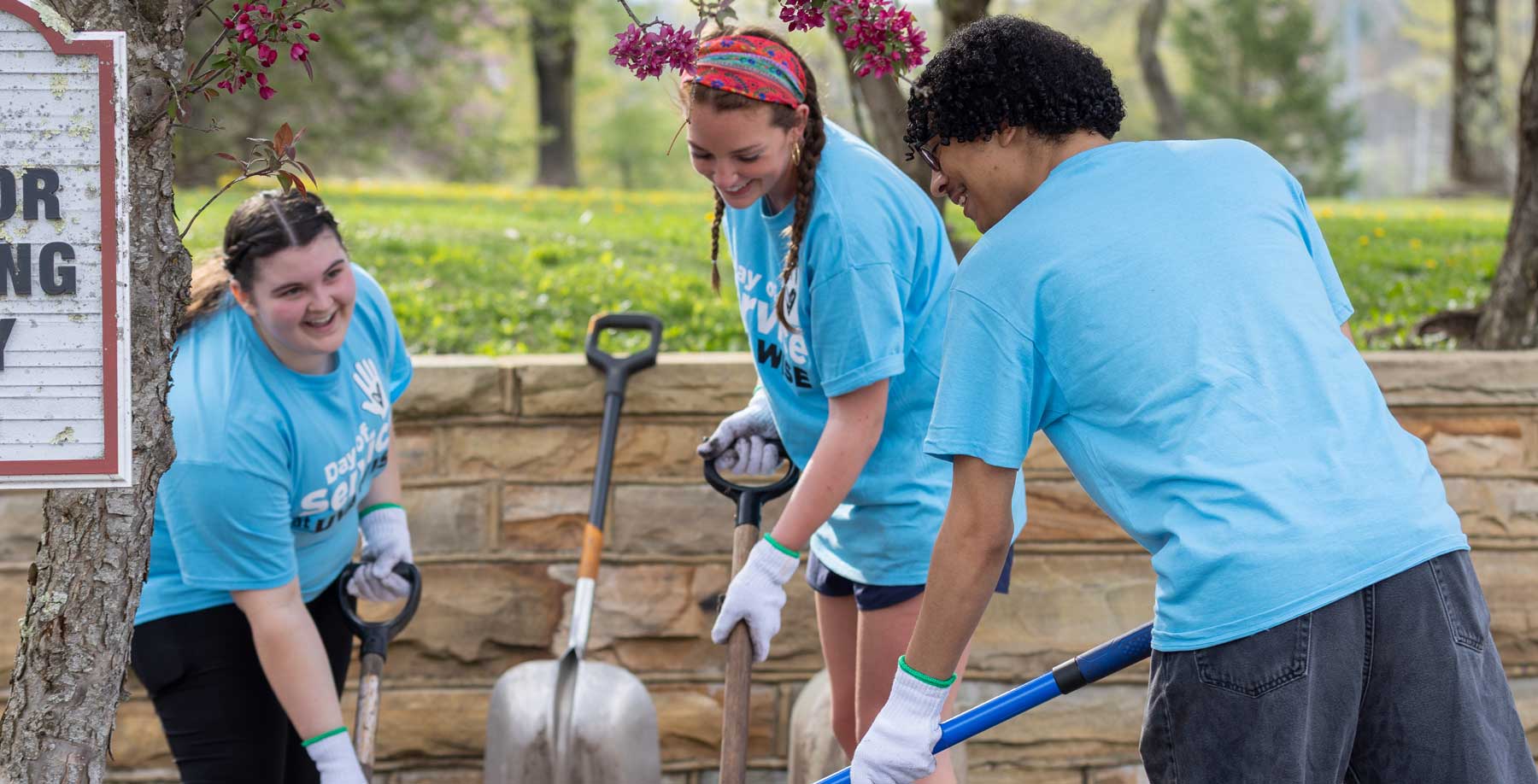 Students with shovels working