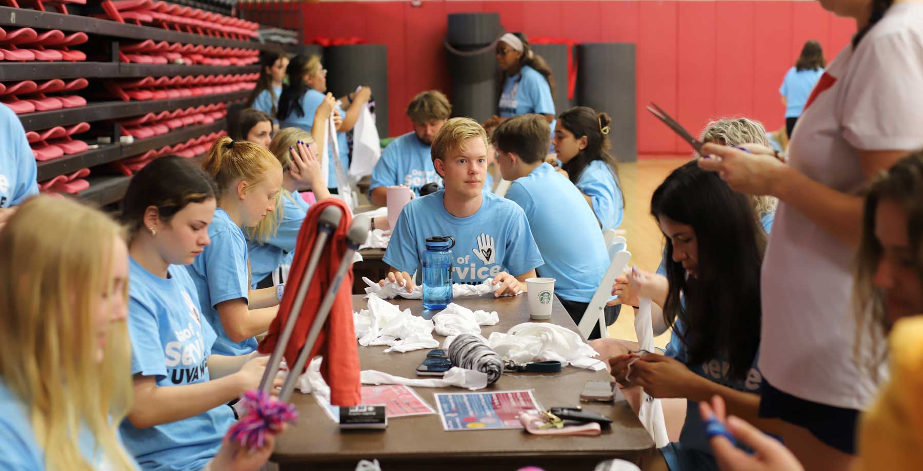 Students sitting around table working on project