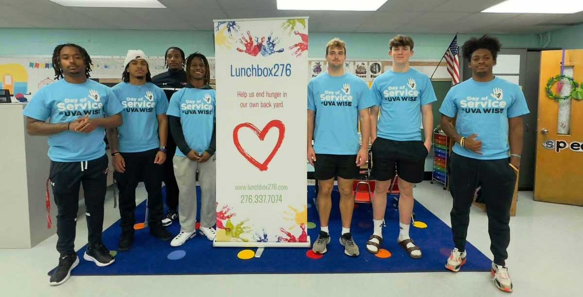 Students with Lunchbox 276 sign