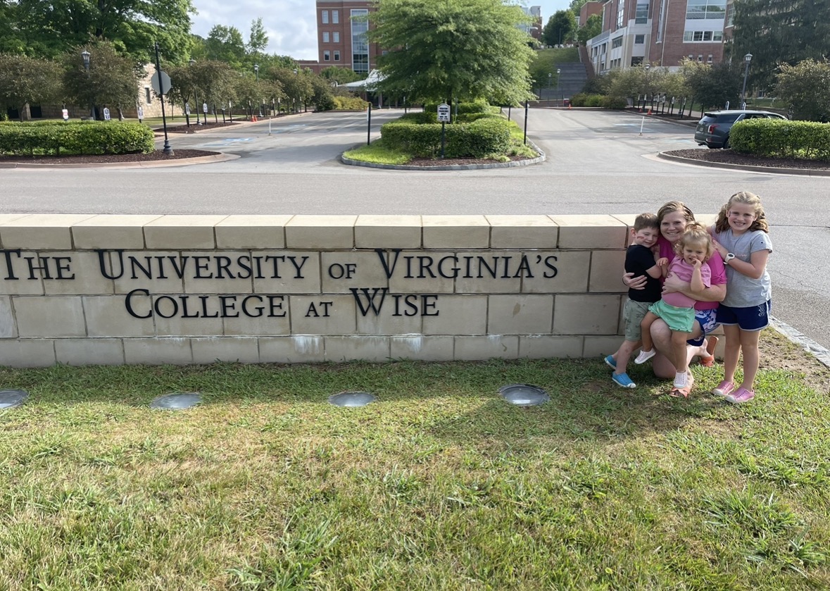 Katie with her children smiling at UVA Wise entrance