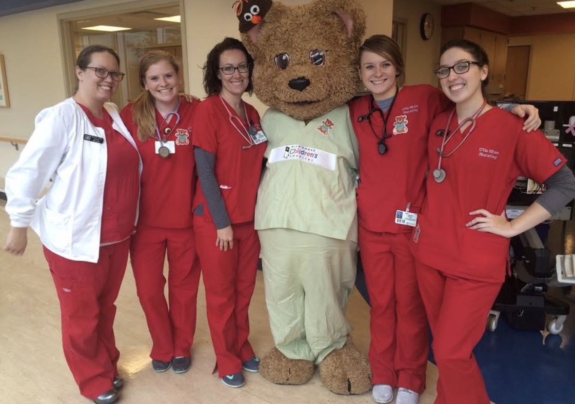Katie and other UVA Wise nursing students smiling with bear mascot
