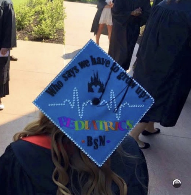 Photo of grad cap that says "Who says we have to grow up? Pediatrics BSN"
