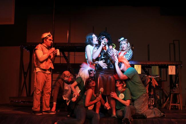 Actors crowd the stage in a scene from the "Alfred Jarry Show"