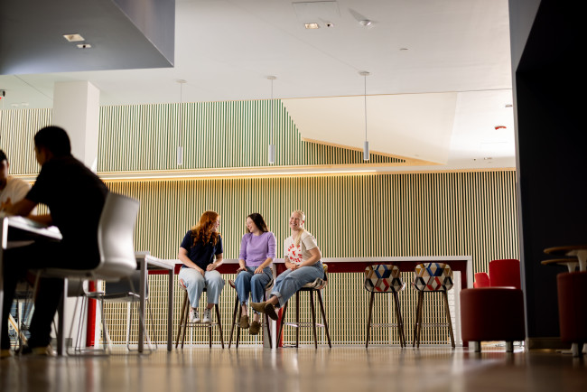 Students sitting in lobby of Pippin-Wyllie Hall