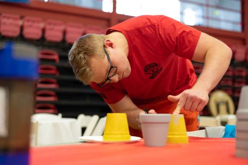 Student painting during Day of Service