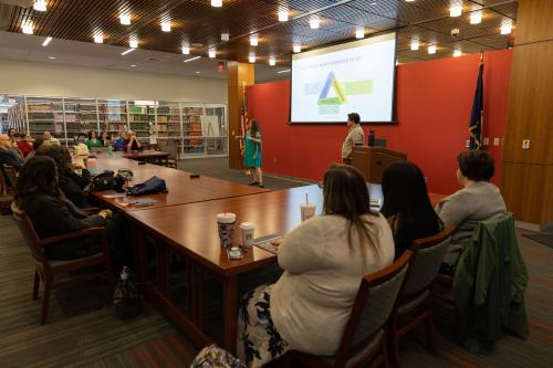 Attendees listen to a presentation