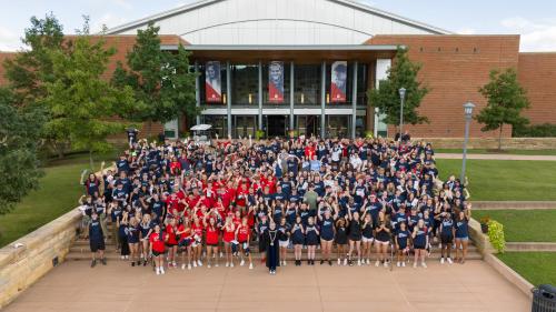 First year students and Chancellor Henry in front of Convocation Center