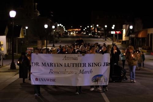 March participants with banner in town