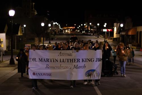 People with banner walking