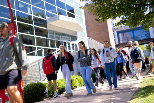 Students walking on sidewalk