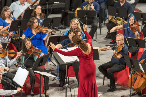 Conductor with musicians in Prior Center