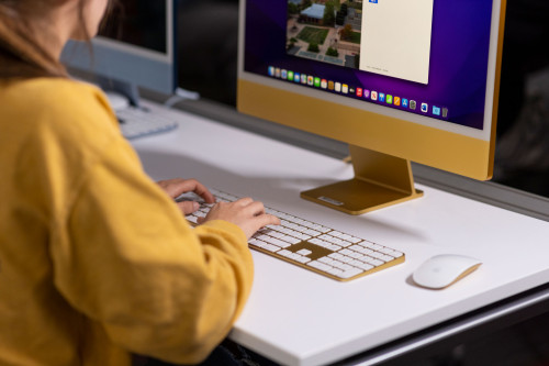 Hands typing at a keyboard