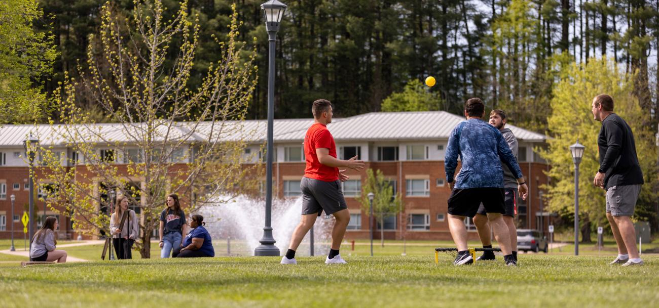 Students playing games on the Lawn by the Lake