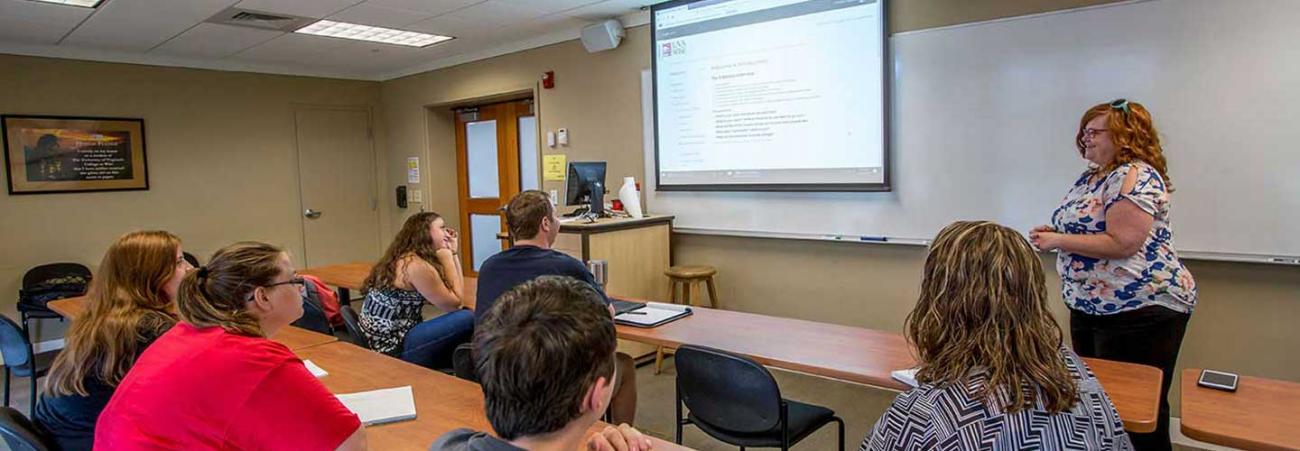 Professor in front of students in classroom