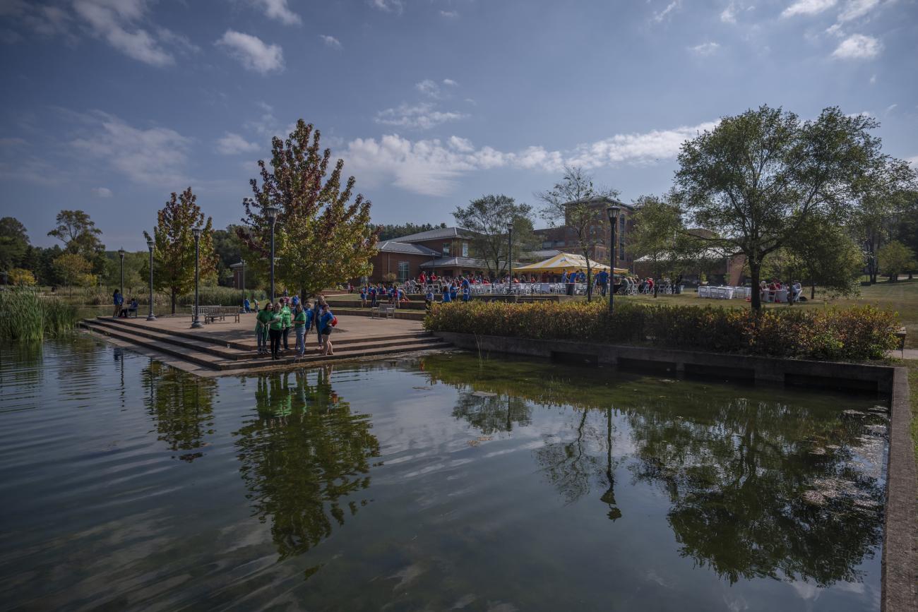 Lake on campus and view of tents