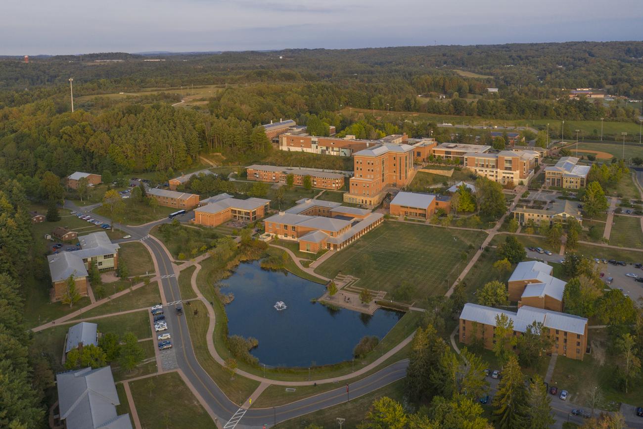 Drone shot of campus with view of lake