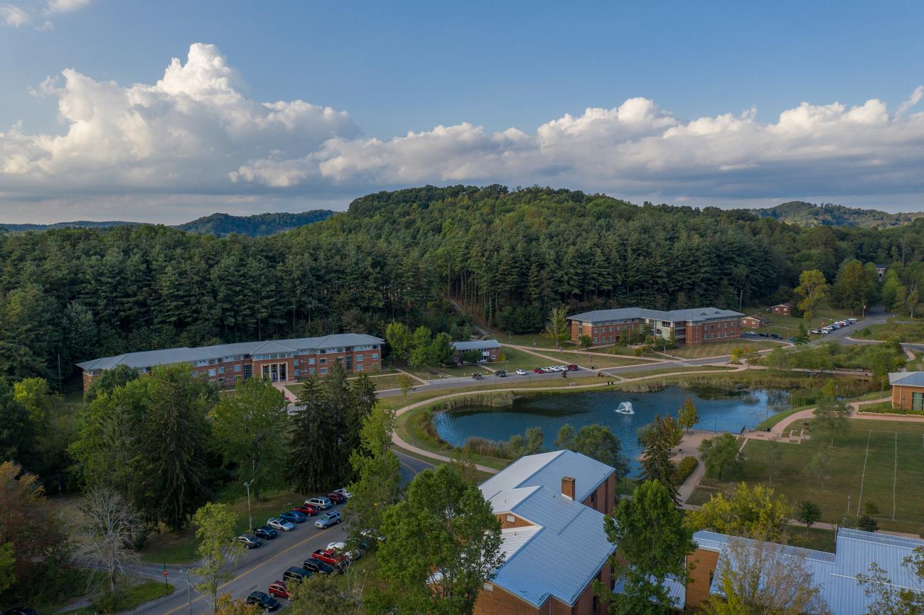 Drone shot of campus overlooking lake