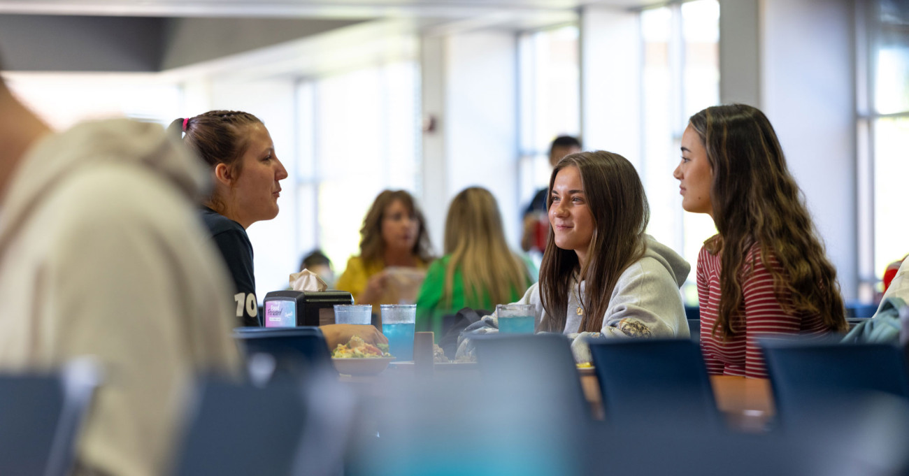 Students at table in dining hall