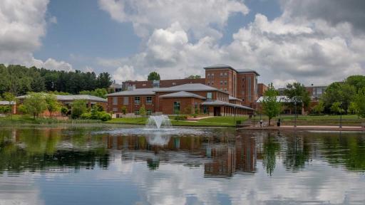 Image of Wise campus building beside pond