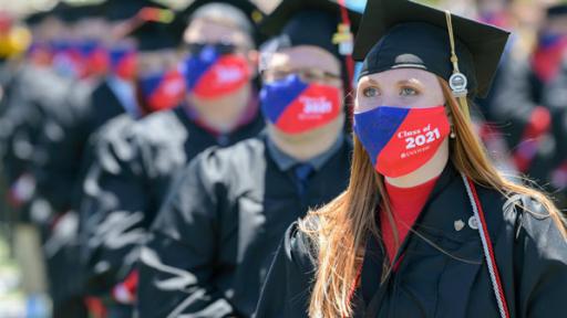 Members of the graduating class in masks