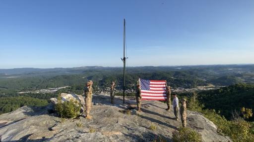ROTC cadets salute a new flag to be raised at Flag Rock in Norton, Va.