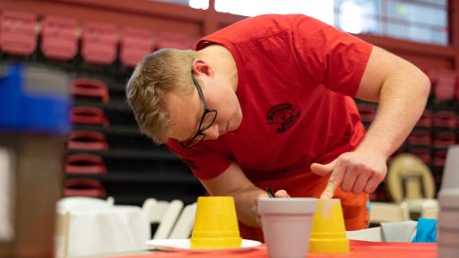 Student painting during Day of Service