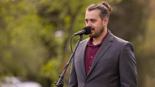 UVA Wise's Robert Arrowood presents at a microphone.