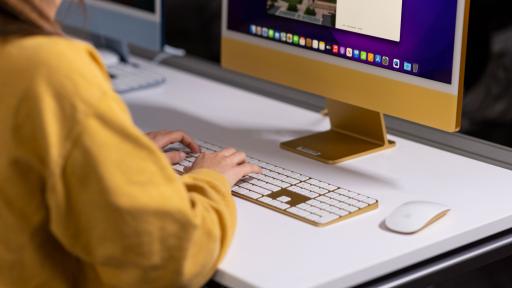 Person typing at computer