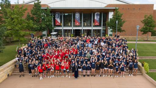 First year students and Chancellor Henry in front of Convocation Center