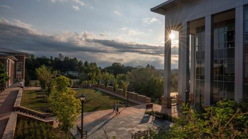 Sunset on campus behind library