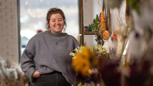 Annie Jordan '23 poses at her new business in downtown Norton.