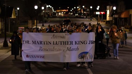 March participants with banner in town