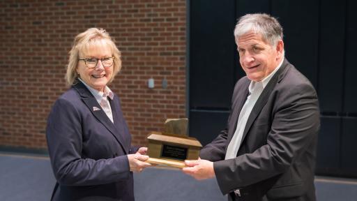 Chancellor Henry presenting Tom DePasquale with award