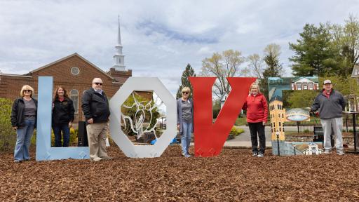Town of Wise officials and Chancellor with Love sign