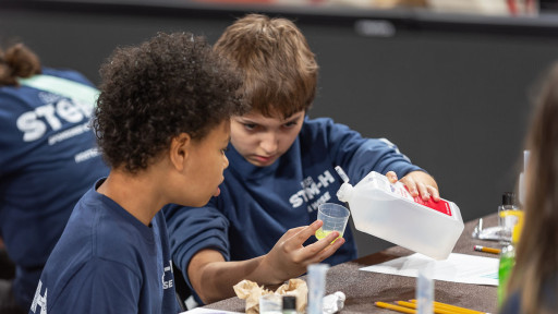 Students participating in stem day experiment