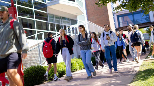 Students walking on sidewalk
