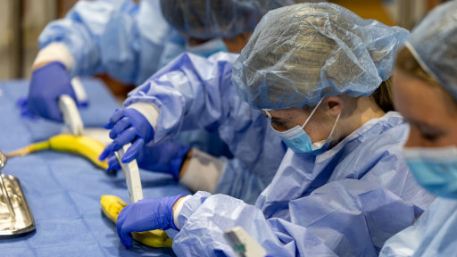 Student in scrubs during workshop